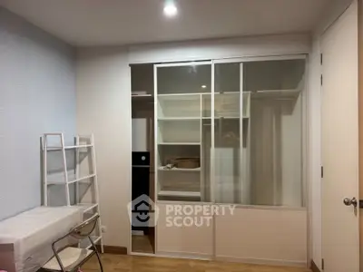 Modern bedroom with sliding closet doors and minimalist decor