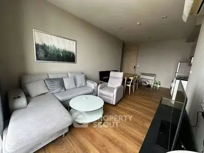 Modern living room with stylish furniture and wooden flooring