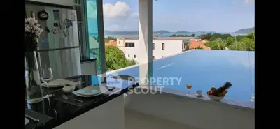 Luxurious kitchen with stunning infinity pool and ocean view, perfect for entertaining and relaxation.
