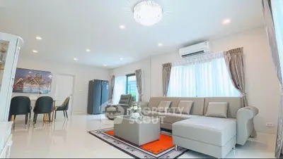 Spacious modern living room with elegant furniture and natural light