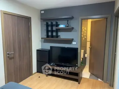 Modern living room with TV and stylish shelving in cozy apartment