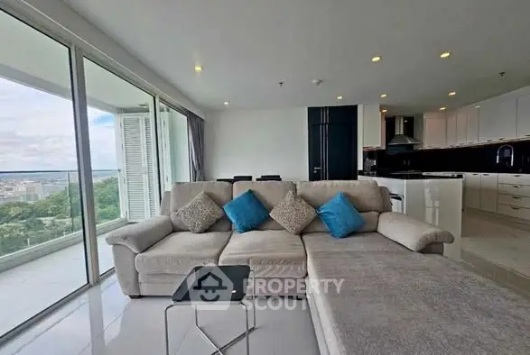 Spacious living room with modern sofa and stunning city view