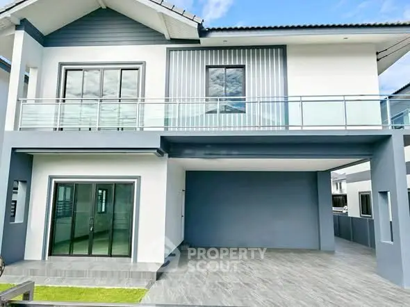 Modern two-story house with sleek design and spacious garage