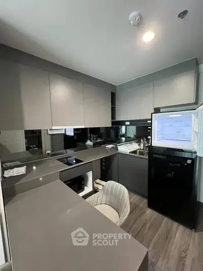 Modern kitchen with sleek cabinetry and integrated appliances