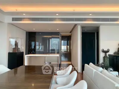 Luxurious modern living room with elegant dining area and sleek kitchen design