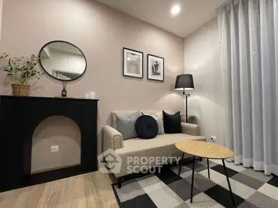 Modern living room with stylish decor, cozy sofa, and elegant lighting