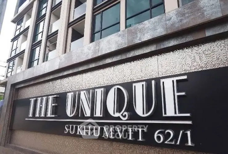 Modern building facade with stylish signage at The Unique Sukhumvit 62/1.