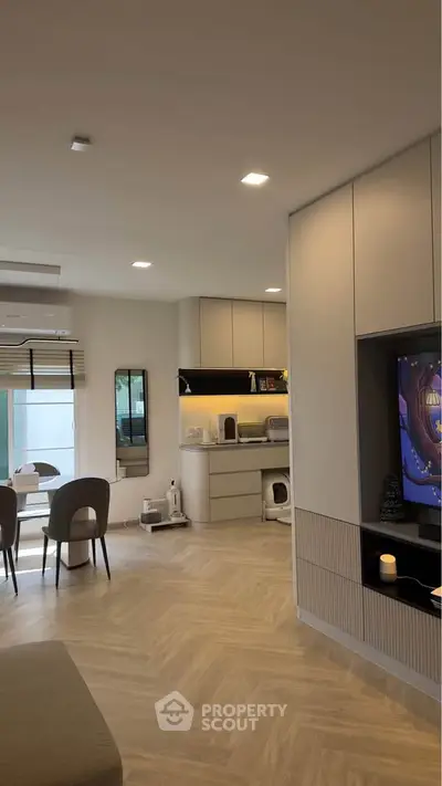 Modern living room with open kitchen and stylish decor