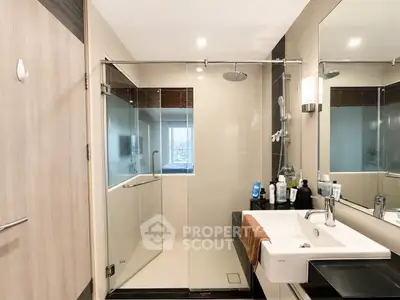Modern bathroom with glass shower and sleek sink design