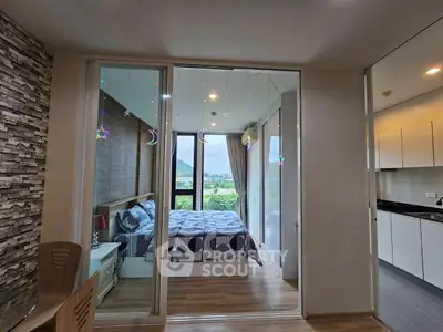 Modern bedroom with glass partition and scenic view