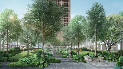 Luxurious garden view of modern residential complex with lush greenery and serene outdoor seating area.