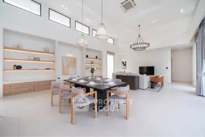 Spacious modern living room with elegant dining area and high ceilings