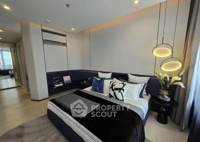 Luxurious modern bedroom with stylish decor and ambient lighting, perfect for relaxation and comfort.