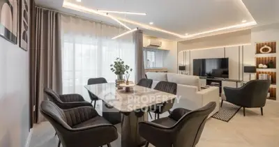 Modern living room with stylish dining area and contemporary lighting