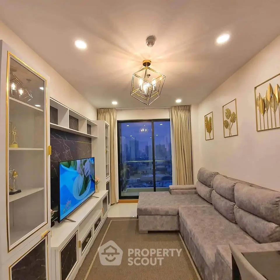 Luxurious living room with modern decor and stunning city view from large window.