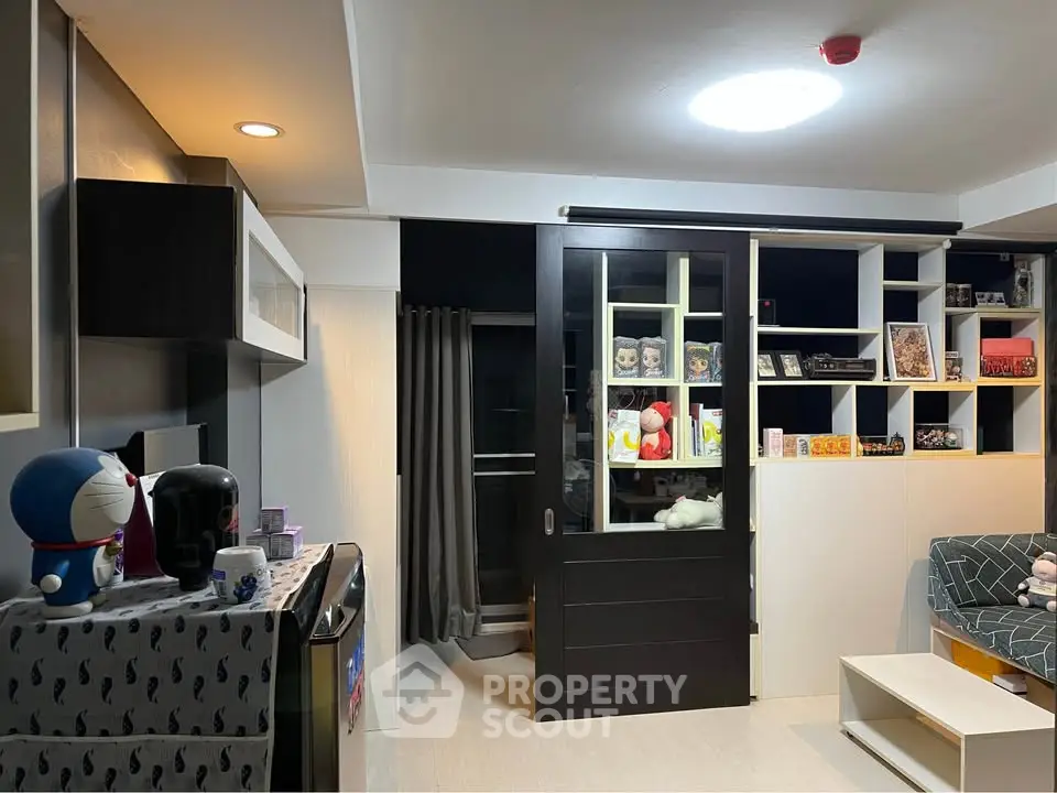 Modern living room with sliding door and stylish shelving