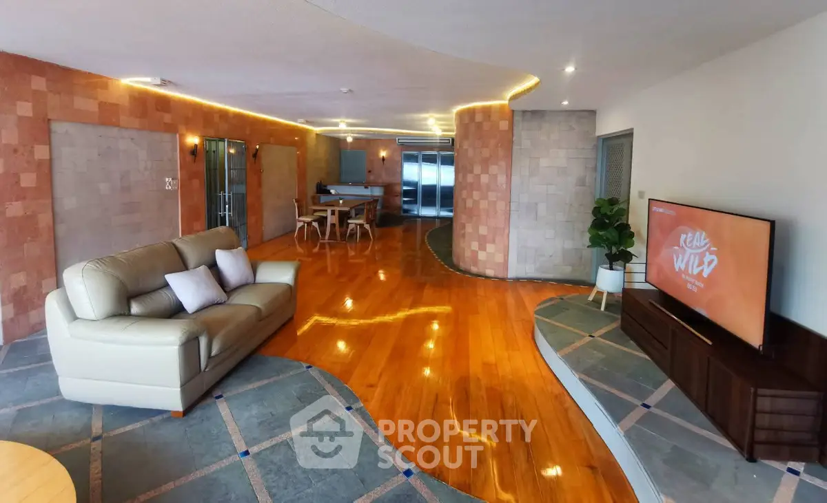 Spacious living room with modern design and elegant wooden flooring