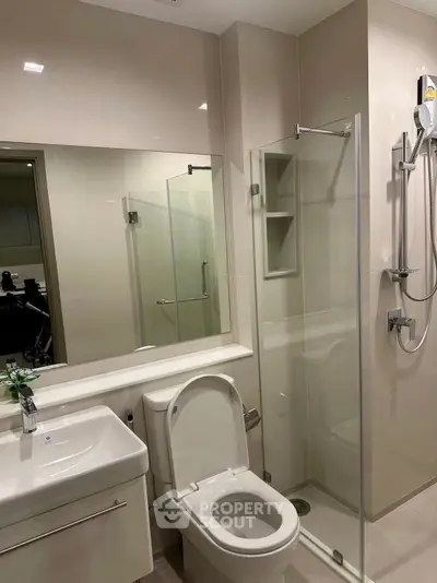 Modern bathroom with glass shower and sleek fixtures