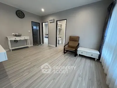 Spacious modern living room with elegant flooring and natural light
