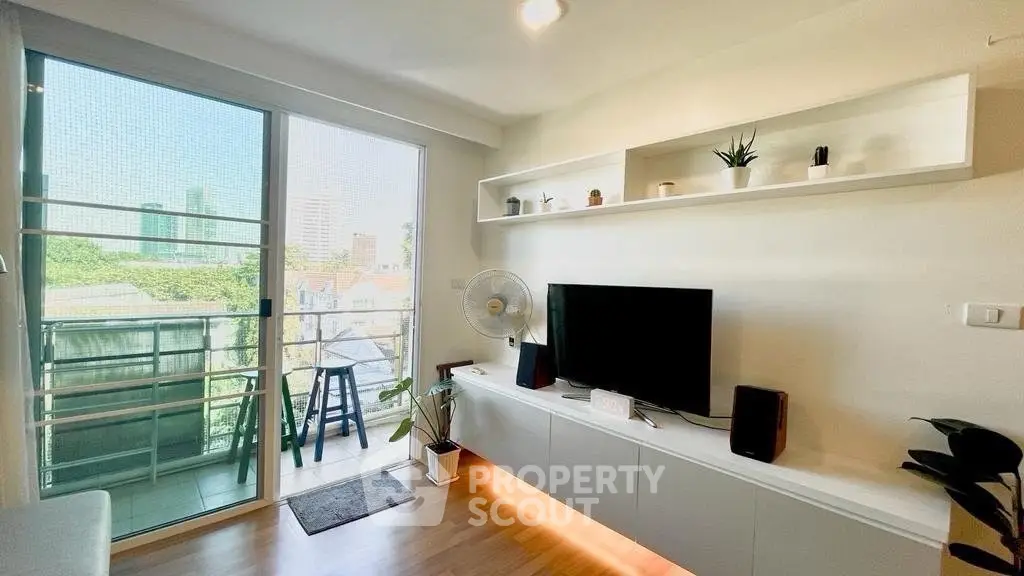 Modern living room with balcony view and stylish decor