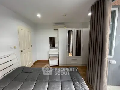 Cozy bedroom with modern furniture and ample natural light