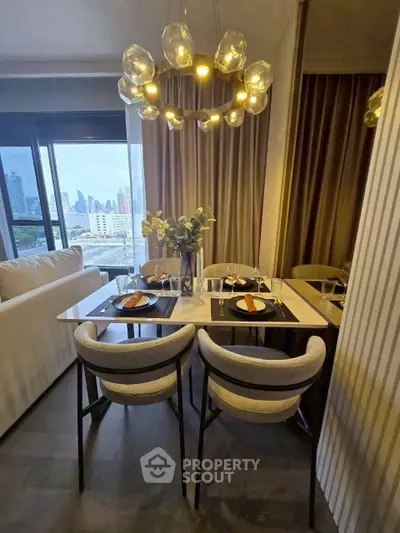 Stylish dining area with city view, modern lighting, and elegant decor in a contemporary apartment.