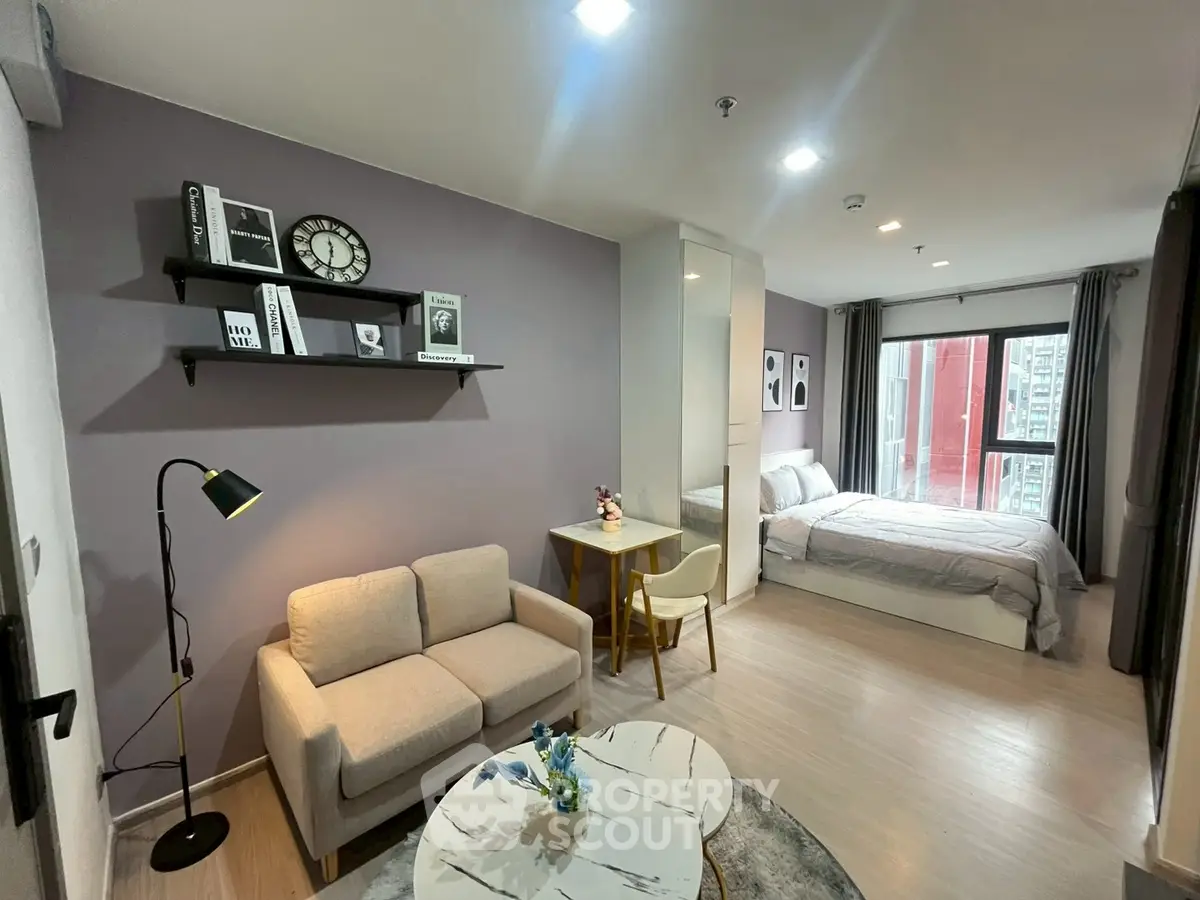 Modern studio apartment with cozy living area and stylish decor