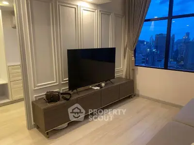 Modern living room with city view and sleek TV setup