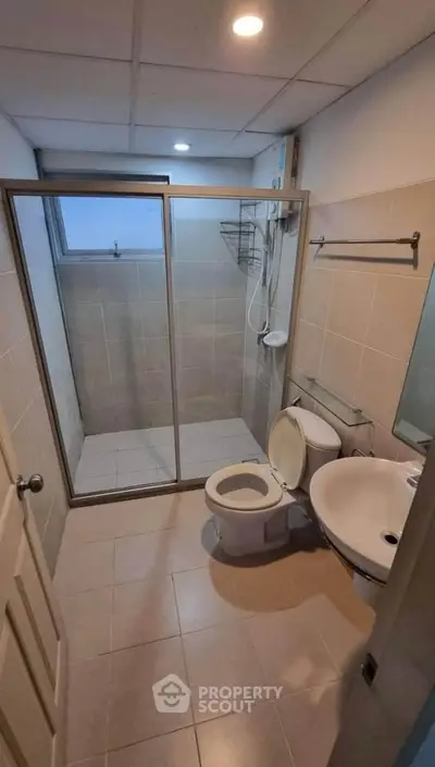 Compact bathroom with shower enclosure and modern fixtures