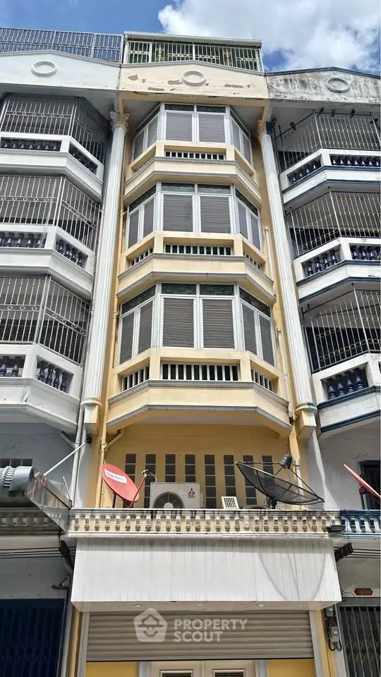 Stunning multi-story building exterior with unique architectural design and vibrant colors.