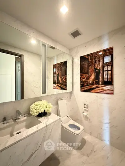 Luxurious marble bathroom with modern fixtures and elegant decor