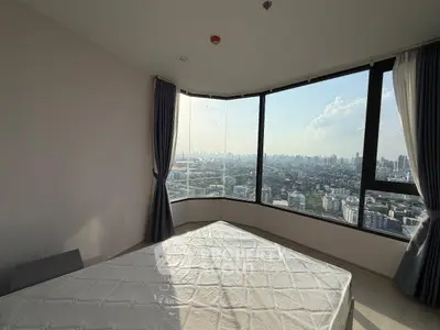 Stunning corner bedroom with panoramic city view and large windows