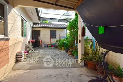 Charming backyard with garden and storage area in cozy residential property.