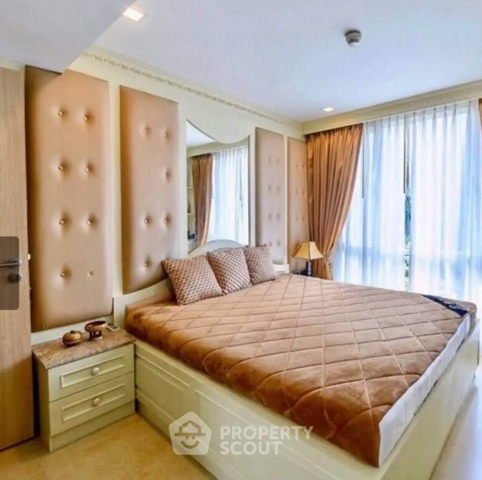 Luxurious bedroom with elegant decor and ample natural light