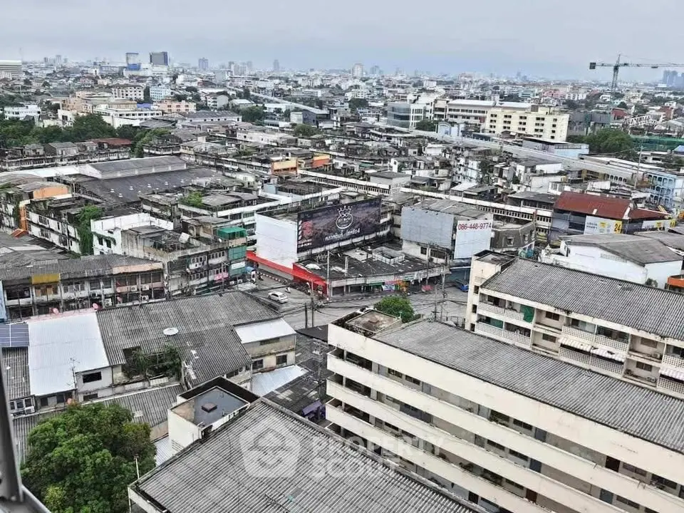 Panoramic cityscape view showcasing urban buildings and skyline from a high vantage point.