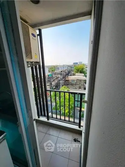Charming balcony with city view, perfect for relaxation and enjoying the urban landscape.