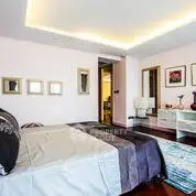 Luxurious bedroom with modern decor and ambient lighting