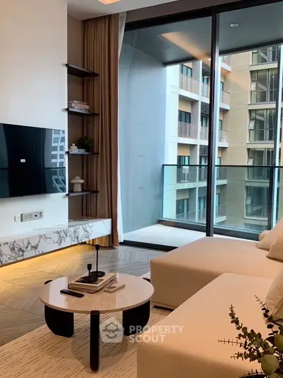 Modern living room with large windows and balcony view in a luxury apartment.