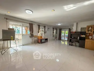 Spacious living room with large windows and modern decor