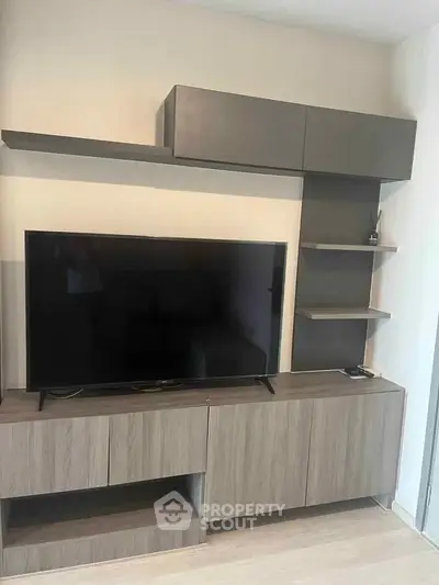 Modern living room with sleek TV unit and stylish shelving, perfect for contemporary home decor.