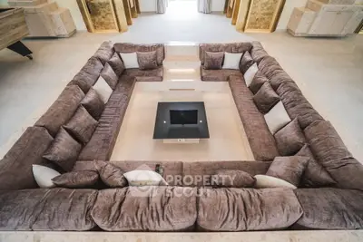 Luxurious sunken living room with plush sectional sofa and modern design