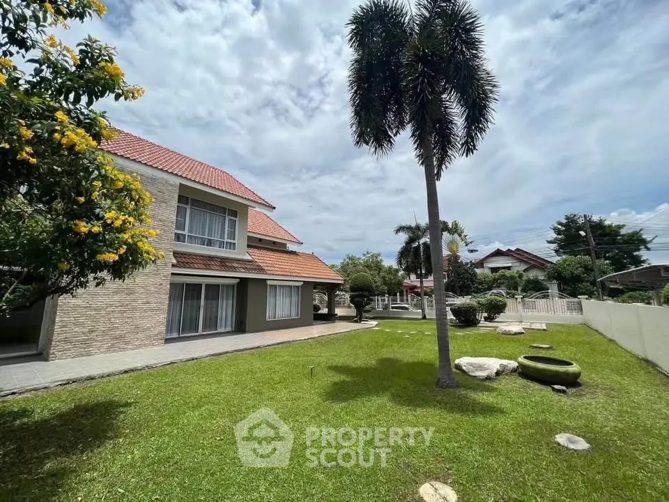 Spacious suburban home with lush garden and modern architecture