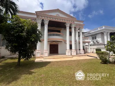 Stunning neoclassical mansion with grand columns and lush garden