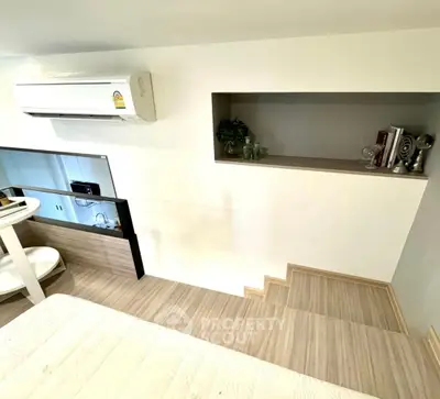 Modern loft bedroom with air conditioning and stylish decor