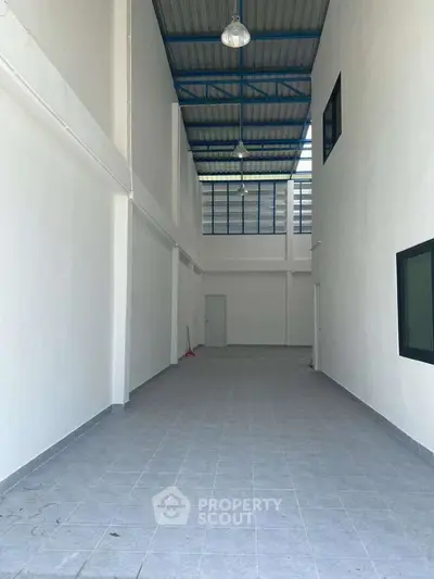 Spacious industrial warehouse with high ceilings and ample natural light