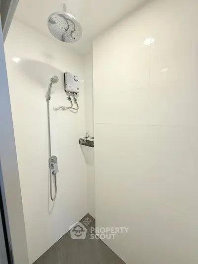 Modern minimalist bathroom with sleek shower design and white tiles