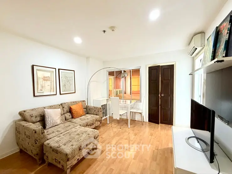 Spacious living room with modern decor and ample natural light