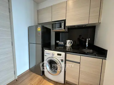 Modern kitchen with sleek appliances and wooden cabinetry