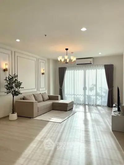 Spacious living room with elegant decor and natural light