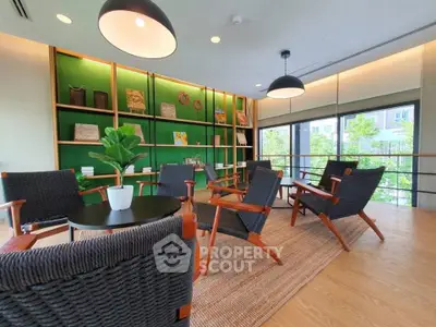 Stylish modern living room with elegant furniture and green accent wall, perfect for relaxation.